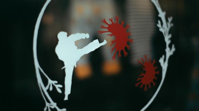 Illustration of someone fighting off germs