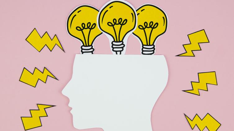Human head profile with light bulbs and lighting strikes